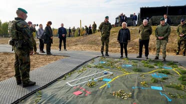 German Defense Minister Christine Lambrecht and Lithuanian Defense Minister Arvydas Anusauskas attend a NATO enhanced Forward Presence German-led battle group military exercise, near Rukla, Lithuania, on October 8, 2022. (Reuters)