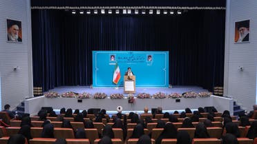 A handout picture provided by the Iranian presidency on October 8, 2022, shows Iran’s President Ebrahim Raisi speaking to female students during a ceremony marking the beginning of the academic year, in the capital Tehran’s Al-Zahra University.