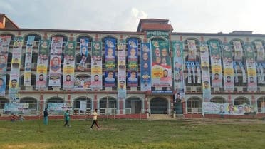 A college in Bangladesh covered with political posters by local activists. (Twitter)