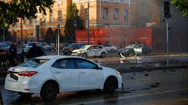 Damaged cars are seen at the scene of Russian missile strikes, as Russia's attack continues, in Kyiv, Ukraine October 10, 2022. REUTERS/Valentyn Ogirenko