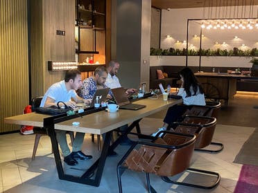 People work as they sit in a cafe at Zabeel House - The Greens, amid the spread of the coronavirus disease (COVID-19) in Dubai, United Arab Emirates February 1, 2021. Picture taken February 1, 2021. (File photo: Reuters)