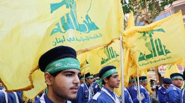 Lebanon's Imam al-Mahdi Scouts carry Hezbollah flags during a religious procession to mark Ashura in Beirut's suburbs, Lebanon August 9, 2022. (Reuters)
