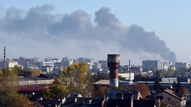 Smoke rises above buildings in the western Ukrainian city of Lviv after Russian missile strikes on October 10, 2022, amid Russia’s invasion of Ukraine. (AFP)