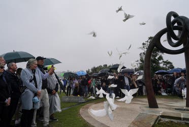 Doves are released during a memorial service to mark the 20th anniversary of the Bali bombings, which killed 202 people including 88 Australians, at Coogee Beach in Sydney, Australia, October 12, 2022. REUTERS/Loren Elliott