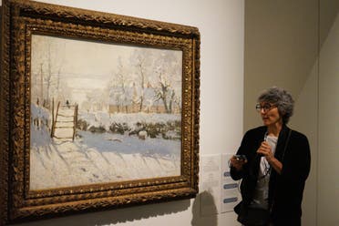 Sylvie Patry, Chief Curator at the Musee d’Orsay with Claude Monet's The Magpie at the Impressionism: Pathways to Modernity exhibition at The Louvre in Abu Dhabi. (Marco Ferrari/Al Arabiya English) 