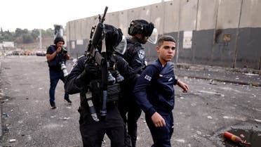 Israeli police detain a Palestinian youth during violent clashes between Palestinians and Israeli forces in the Shuafat refugee camp in East Jerusalem October 12, 2022. (Reuters)
