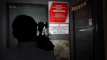 A cameraman takes visuals outside the office of Maiden Pharmaceuticals Ltd. company, in New Delhi, India, on October 6, 2022. (Reuters)