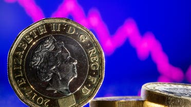 British pound coins are seen in front of displayed stock graph in this illustration taken, November 9, 2021. (File Photo: Reuters)