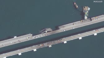 Russia says key Crimea bridge damaged in blast reopens 