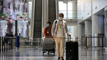 Travellers arrive at the Hong Kong International Airport on the first day the COVID hotel quarantine has been scrapped, in Hong Kong, China September 26, 2022. (Reuters)