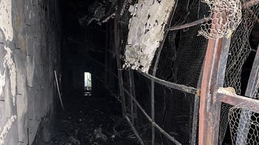 This image obtained from the Iranian news agency IRNA on October 16, 2022, shows damage caused by a fire inside the building of the Evin prison, in the northwest of the Iranian capital Tehran. The unrest at the prison came as Iran has been rocked by weeks of protests since Mahsa Amini's death on September 16, three days after she was arrested by morality police in Tehran for allegedly violating the country's strict dress code for women. (AFP)