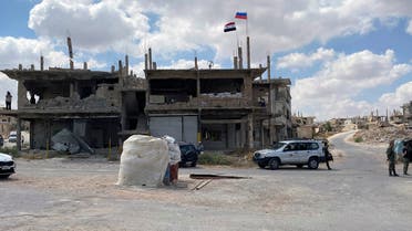 Syrian soldiers stand guard near a damaged building in the southern city of Daraa, Syria, Sunday, Sept 12, 2021. A Russian-negotiated deal went into effect last week to end a government siege and intense fighting in the city of Daraa and with rebel fighters holed up Daraa al-Balad forcing some of them to go to the rebel-held north and others to surrender their weapons in return for amnesty. (AP Photo)