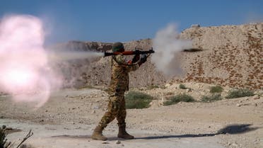 A fighter from the Third Legion of the Turkish-backed Free Syrian Army (TFSA) takes part in a military training exercise near the border town of Azaz in the rebel-held north of the Aleppo province on September 15, 2022. (Photo by AFP)