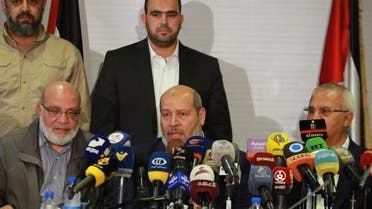 Senior official of the Palestinian Islamic Jihad movement, Abdulaziz al-Minawi (L), Hamas arab relations chief Khalil al-Hayya (C), and secretary general of the Popular Front for the Liberation of Palestine, Talal Naji, hold a press conference during a visit to the Syrian capital Damascus on October 19, 2022. (AFP)