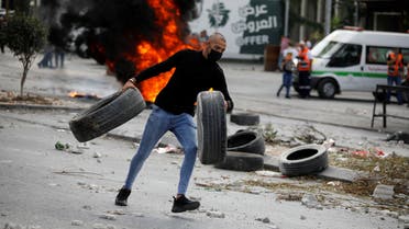 Palestinians clash with Israeli forces during a protest demanding Israel reopen closed roads leading to Nablus, in Deir Sharaf, in the Israeli-occupied West Bank, October 20, 2022. (Reuters)