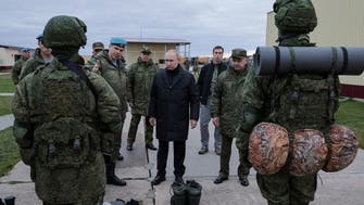 Russia’s Putin visits military draft training center