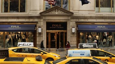 eople walk by Ralph Lauren's Fifth Avenue Polo store on April 4, 2017 in New York City. (File photo: AFP)