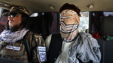 A suspected ISIS member sits blindfolded in a Taliban Special Forces' car in Kabul, Afghanistan, September 5, 2021. (Reuters)