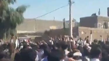 This grab from a UGC video posted on October 21, 2022, shows demonstrators gesturing as they march on a street in the southeastern Iranian city of Zahedan. Cities across Iran have seen protests since 22-year-old Iranian woman Mahsa Amini died on September 16, after her arrest by the morality police in Tehran for allegedly failing to observe the Islamic republic's strict dress code for women. (Photo by UGC / AFP) / ISRAEL OUT / XGTY/RESTRICTED TO EDITORIAL USE - MANDATORY CREDIT AFP - SOURCE: ANONYMOUS - NO MARKETING - NO ADVERTISING CAMPAIGNS - NO INTERNET - DISTRIBUTED AS A SERVICE TO CLIENTS - NO RESALE - NO ARCHIVE -NO ACCESS ISRAEL MEDIA/PERSIAN LANGUAGE TV STATIONS OUTSIDE IRAN/ STRICTLY NO ACCESS BBC PERSIAN/ VOA PERSIAN/ MANOTO-1 TV/ IRAN INTERNATIONAL/RADIO FARDA - AFP IS NOT RESPONSIBLE FOR ANY DIGITAL ALTERATIONS TO THE PICTURE'S EDITORIAL CONTENT - XGTY/RESTRICTED TO EDITORIAL USE - MANDATORY CREDIT AFP - SOURCE: ANONYMOUS - NO MARKETING - NO ADVERTISING CAMPAIGNS - NO INTERNET - DISTRIBUTED AS A SERVICE TO CLIENTS - NO RESALE - NO ARCHIVE -NO ACCESS ISRAEL MEDIA/PERSIAN LANGUAGE TV STATIONS OUTSIDE IRAN/ STRICTLY NO ACCESS BBC PERSIAN/ VOA PERSIAN/ MANOTO-1 TV/ IRAN INTERNATIONAL/RADIO FARDA - AFP IS NOT RESPONSIBLE FOR ANY DIGITAL ALTERATIONS TO THE PICTURE'S EDITORIAL CONTENT