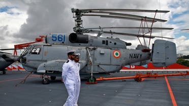 Members of Indian Navy walk past a helicopter parked on the deck of India's first home-built aircraft carrier INS Vikrant after its commissioning ceremony at a state-run shipyard in Kochi, India, September 2, 2022. (File photo: Reuters)