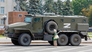 FILE PHOTO: An armoured truck of pro-Russian troops is parked near Ukraine's former regional council's building during Ukraine-Russia conflict in the Russia-controlled city of Kherson, Ukraine July 25, 2022. REUTERS/Alexander Ermochenko/File Photo