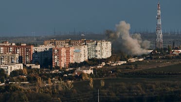 A plume of smoke rises after Russian shelling in Bakhmut, Donetsk region, Ukraine, Saturday, Oct. 22, 2022. (AP Photo/LIBKOS)