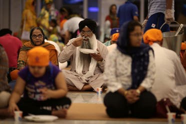 People break their fast in the langar, the Sikh term used for community kitchen, at the GuruNanak Darbar Sikh temple, during the Muslim holy month of Ramadan in Dubai, United Arab Emirates May 23, 2019. (File photo: Reuters)
