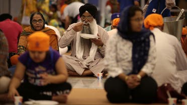 People break their fast in the langar, the Sikh term used for community kitchen, at the GuruNanak Darbar Sikh temple, during the Muslim holy month of Ramadan in Dubai, United Arab Emirates May 23, 2019. (File photo: Reuters)
