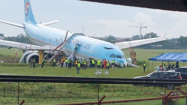 Response crews gather around a Korean Air Airbus A330 widebody flying from Seoul to Cebu, which tried to land twice in poor weather before it overran the runway on the third attempt on Sunday, in Lapu-Lapu City, Cebu, Philippines October 24, 2022 in this picture obtained from social media. (Reuters)