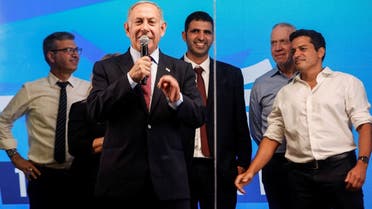 Former Israeli Prime Minister Benjamin Netanyahu addresses his supporters from a truck at a campaign event in the run up to Israel’s elections in Ramla, Israel, September 29, 2022. (Reuters)     