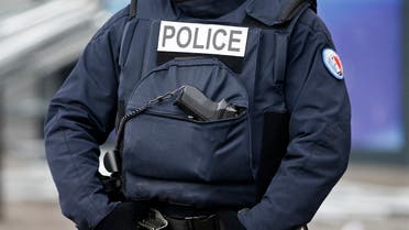 A policeman wearing a bullet proof vest stands guard in front of the Hyper Cacher kosher supermarket at the Porte de Vincennes in Paris January 21, 2015. (Reuters)
