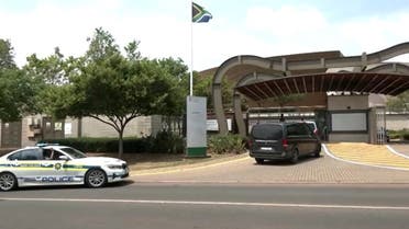 A screen grab from video shows vehicles arriving at the Department of International Relations and Cooperation (DIRCO) in Pretoria, South Africa, October 24, 2022. (Reuters)