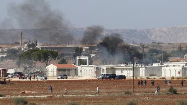 Smoke seen in Pournara refugee camp during clashes on the outskirts of Nicosia, Cyprus. (AFP)