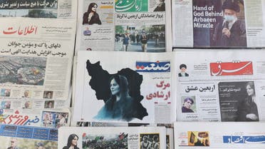 Newspapers, with a cover picture of Mahsa Amini, a woman who died after being arrested by the Islamic republic's morality police are seen in Tehran, Iran September 18, 2022. Majid Asgaripour/WANA (West Asia News Agency) via REUTERS ATTENTION EDITORS - THIS IMAGE HAS BEEN SUPPLIED BY A THIRD PARTY.