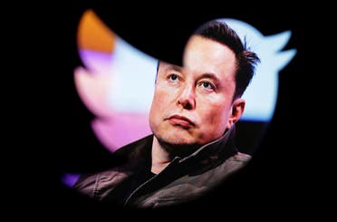Elon Musk's photo is seen through a Twitter logo in this illustration. (Reuters)