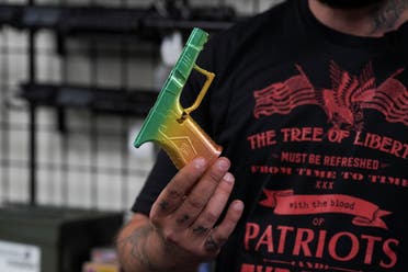 Dimitri Karras shows a custom 3D-printed lower receiver for a Glock pistol inside Firearms Unknown, a gun store in Oceanside, California, US, April 12, 2021. (File photo: Reuters)