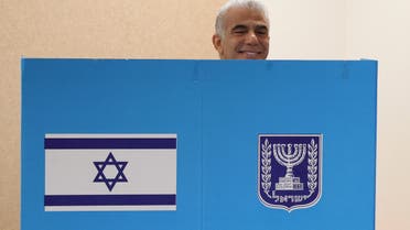 Israeli Prime Minister Yair Lapid smiles as he casts his vote at a polling station in Israel's coastal city of Tel Aviv in the coutnry's fifth election in four years on November 1, 2022. (Reuters)