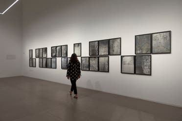19)	Navjot Altaf, Installation view of Lost Text (2017-2018). 24 digital prints on canson platine fiber rag paper pasted on archival conservation board and PVC transfer on acrylic, 64.7 x 52.1 cm each. Shown in Navjot Altaf: Pattern at Ishara Art Foundation, 2022. Image courtesy of Ishara Art Foundation and the artist. Photo by Ismail Noor/Seeing Things.