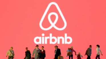 FILE PHOTO: Small toy figures are seen in front of diplayed Airbnb logo in this illustration taken March 19, 2020. REUTERS/Dado Ruvic/Illustration/File Photo
