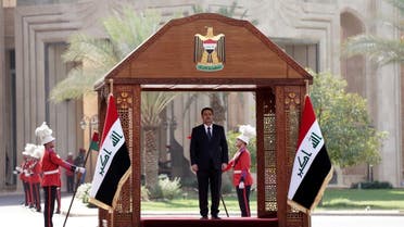 A handout picture released by Iraq's prime minister's office shows the new Prime Minister Mohamed Shia al-Sudani arriving for the official handover ceremony at the Republican Palace, the government's seat, in Baghdad's green zone. (AFP)