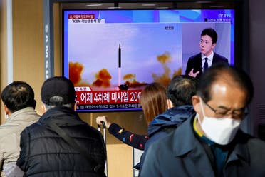 People watch a TV broadcasting a news report on North Korea firing a ballistic missile off its east coast, in Seoul, South Korea, November 3, 2022.