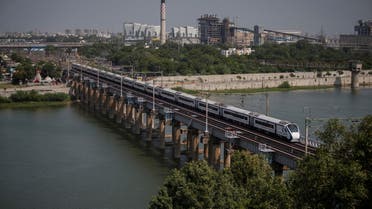 India's high-speed train 'Vande Bharat Express' passes a railway bridge after being inaugurated by Prime Minister Narendra Modi, in Ahmedabad, India, September 30, 2022. (Reuters)