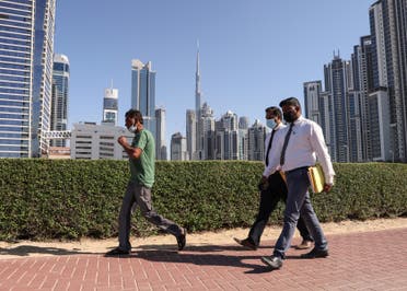 Employees walk to work on the first working Friday in the Gulf Emirate of Dubai, on January 7, 2022. (File photo: AFP)