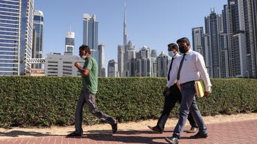 Employees walk to work on the first working Friday in the Gulf Emirate of Dubai, on January 7, 2022. (File photo: AFP)
