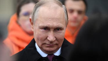 Russian President Vladimir Putin speaks with members of public associations, youth and volunteer organizations during a flower-laying ceremony at the monument to Kuzma Minin and Dmitry Pozharsky while marking Russia's Day of National Unity in Red Square in central Moscow, Russia November 4, 2022. Sputnik/Grigory Sysoyev/Pool via REUTERS ATTENTION EDITORS - THIS IMAGE WAS PROVIDED BY A THIRD PARTY.