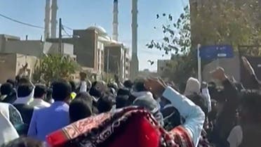 This image grab from a UGC video made available on October 14, 2022, shows Iranian protesters chanting slogans as they march in a street in the southeastern city of Zahedan. Cities across Iran have seen protests since 22-year-old Iranian woman Mahsa Amini died on September 16 after her arrest by the morality police in Tehran for allegedly failing to observe the Islamic republic's strict dress code for women. (Photo by UGC / AFP) / ISRAEL OUT / XGTY/RESTRICTED TO EDITORIAL USE - MANDATORY CREDIT AFP - SOURCE: ANONYMOUS - NO MARKETING - NO ADVERTISING CAMPAIGNS - NO INTERNET - DISTRIBUTED AS A SERVICE TO CLIENTS - NO RESALE - NO ARCHIVE -NO ACCESS ISRAEL MEDIA/PERSIAN LANGUAGE TV STATIONS OUTSIDE IRAN/ STRICTLY NO ACCESS BBC PERSIAN/ VOA PERSIAN/ MANOTO-1 TV/ IRAN INTERNATIONAL/RADIO FARDA - AFP IS NOT RESPONSIBLE FOR ANY DIGITAL ALTERATIONS TO THE PICTURE'S EDITORIAL CONTENT - XGTY/RESTRICTED TO EDITORIAL USE - MANDATORY CREDIT AFP - SOURCE: ANONYMOUS - NO MARKETING - NO ADVERTISING CAMPAIGNS - NO INTERNET - DISTRIBUTED AS A SERVICE TO CLIENTS - NO RESALE - NO ARCHIVE -NO ACCESS ISRAEL MEDIA/PERSIAN LANGUAGE TV STATIONS OUTSIDE IRAN/ STRICTLY NO ACCESS BBC PERSIAN/ VOA PERSIAN/ MANOTO-1 TV/ IRAN INTERNATIONAL/RADIO FARDA - AFP IS NOT RESPONSIBLE FOR ANY DIGITAL ALTERATIONS TO THE PICTURE'S EDITORIAL CONTENT