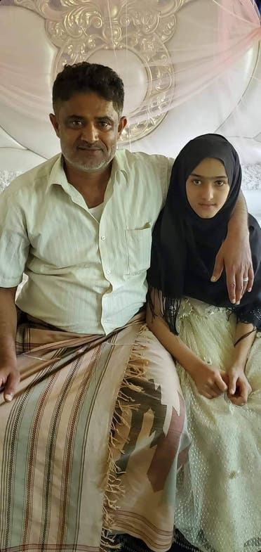 Little girl Noha with one of her rights defenders