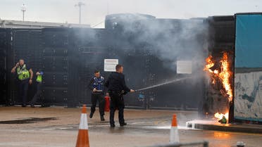 Members of the military and UK Border Force extinguish a fire from a petrol bomb, targeting the Border Force centre in Dover, Britain, October 30, 2022. (File photo: Reuters)