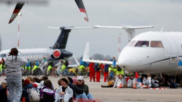 Climate activists protest against environmental pollution from aviation at Amsterdam's Schiphol Airport, in Schiphol, Netherlands November 5, 2022. REUTERS/Piroschka van de Wouw