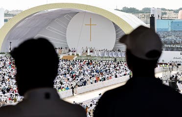 People attend a holy mass at Bahrain National Stadium during Pope Francis' apostolic journey, in Riffa, Bahrain, November 5, 2022. (Reuters)